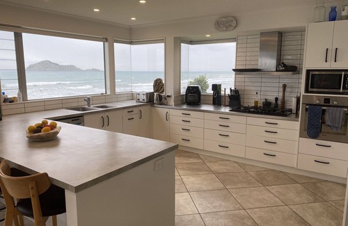 Waimarama House | Ultimate Beachfront - Family Friendly with games room and multiple decks