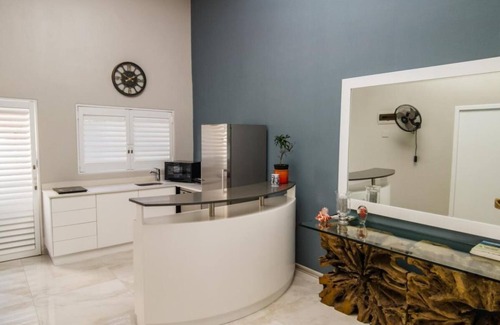 La Lucia House | Umhlanga Lodge Room leads of a shared kitchenette and dining room