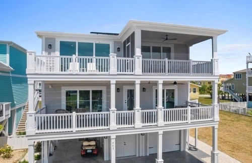 Sunset Beach House | Undoer of Knots is a luxurious beach home with 6 bedrooms designed for relaxation.