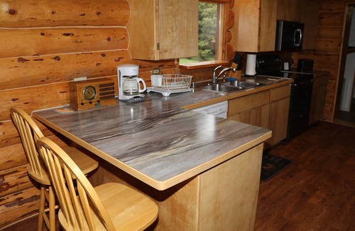 Anchor Point House | Unique Alaskan log home in trees & wild flowers on 14-acre private homestead.