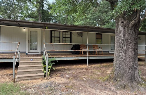 Fairbanks House | Unique camp style house with large wrap around deck.