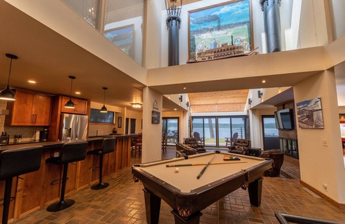 Sunnyland House | Unique riverfront home w/beach, dock, watersports, firepit, hot tub, and sauna!