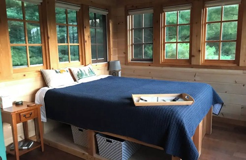 East Leroy Bed & Breakfast | Unique treehouse cabin with all amenities inspired by forest ranger lookout.