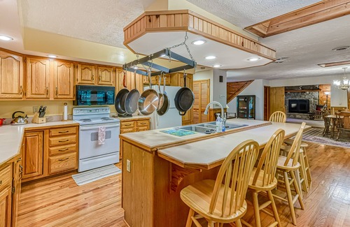 McHenry Cabin | Updated cabin with private hot tub, wraparound deck & forest view - dog-friendly