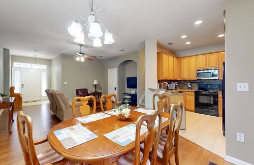 Trafalgar Village House | Updated retreat with pool access, W/D, AC, & patio - close to Disney Parks