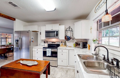 Milton House | Updated waterfront home with spacious outdoor living area, gaming room