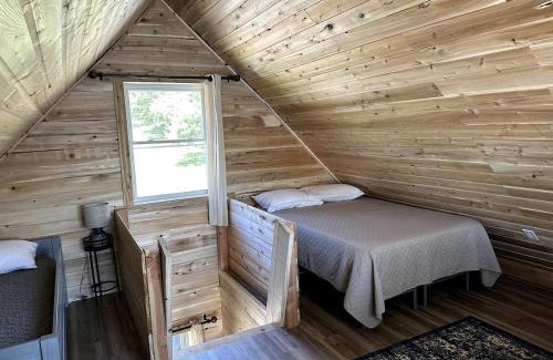 Portage Lake House | Magnificent Cabin Nestled Amidst Trees in Portage Lake, Maine