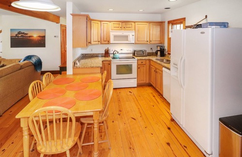 Chincoteague House | Utter East - great home with large screened porch and firepit next to the pond