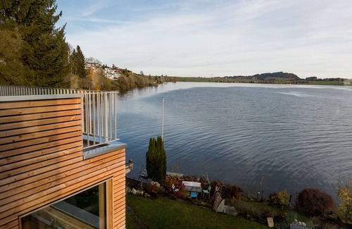 Gross Condo | Vacation dream directly on Lake Sihl with its own beach