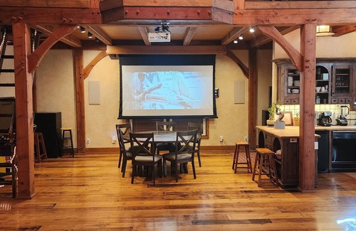 Sundance Cabin | Vaulted beam ceilings, a huge rock fireplace, stream nearby, large campfire area