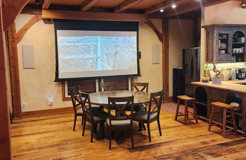Sundance Cabin | Vaulted beam ceilings, a huge rock fireplace, stream nearby, large campfire area