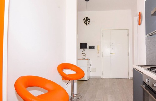 Ostiense Apartment | Vibrantly colored apartment on Salvatore Pincherle Street for 4 to four ospi