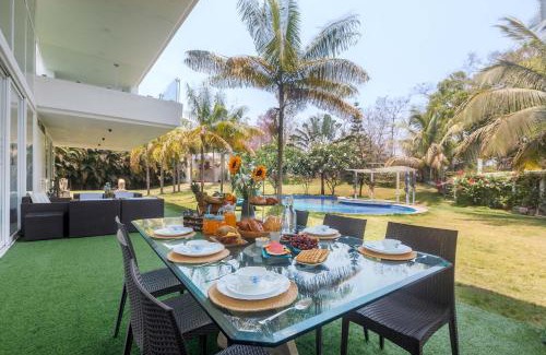 Alibaug Villa | Villa Capri by StayVista - Featuring a swimming pool, mountain view and snooker table