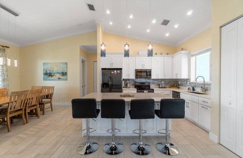 Breezeswept Beach Estates House | Villa Lucie | Canalfront home w/5 bedrooms + pool + boat lift