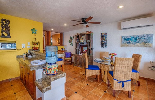 Akumal Condo | Walk onto the white sandy beach of Half Moon Bay from your patio door!