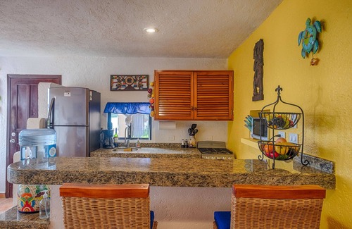 Akumal Condo | Walk onto the white sandy beach of Half Moon Bay from your patio door!