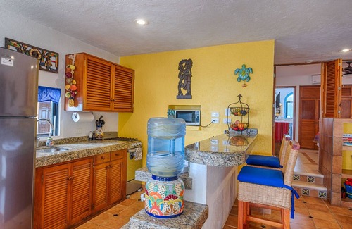 Akumal Condo | Walk onto the white sandy beach of Half Moon Bay from your patio door!
