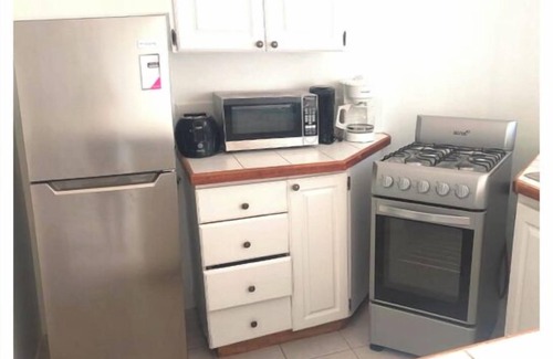 Bon Accord Village House | Walking Distance to Airport and Beaches! Carefree Family Home in Gated Community