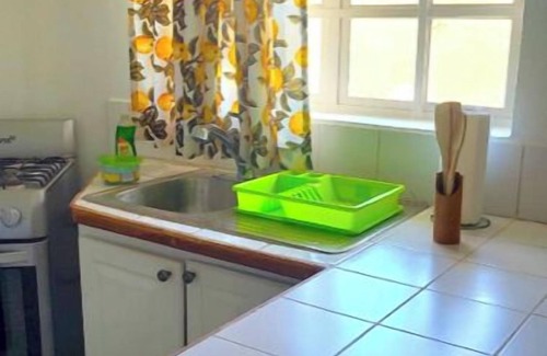 Bon Accord Village House | Walking Distance to Airport and Beaches! Carefree Family Home in Gated Community