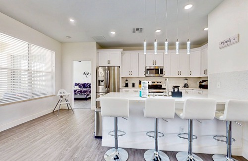Trafalgar Village House | Water view retreat with lanai, heated pool, pool spa, game room, & AC