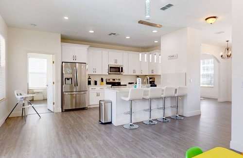 Trafalgar Village House | Water view retreat with lanai, heated pool, pool spa, game room, & AC