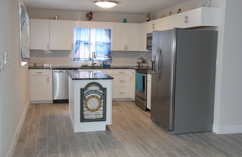 Inlet Harbour House | Waterfront 5-Bedroom Home with Hot Tub & Amenities