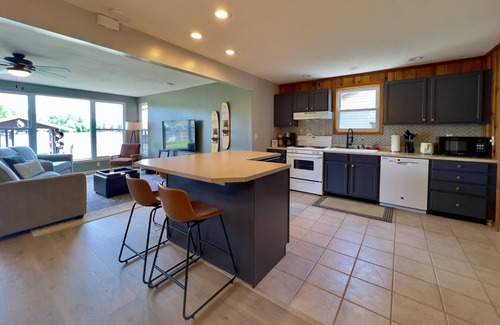 Russells Point Cabin | Waterfront Cabin with Hot Tub, Outside Bar & Private Dock!