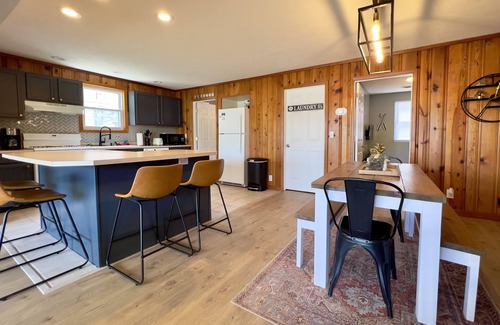 Russells Point Cabin | Waterfront Cabin with Hot Tub, Outside Bar & Private Dock!