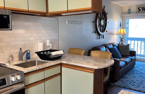 Huddleston Condo | Waterfront Condo with Pool for Romantic Getaways and Fisherman. Pet Friendly!