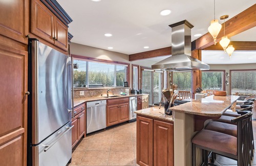 Post Falls House | Waterfront Estate w/Private Hot Tub, Dock, Firepit, Gourmet Kitchen & Game Room