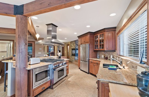 Post Falls House | Waterfront Estate w/Private Hot Tub, Dock, Firepit, Gourmet Kitchen & Game Room