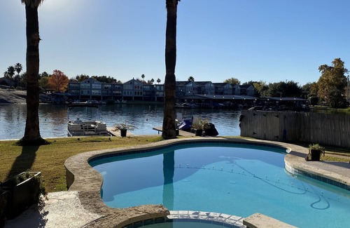 Granite Shoals House | Waterfront Home with pool Surrounded by Palm Trees