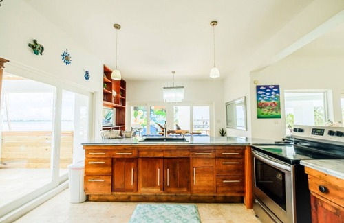 Gales Point Apartment | Waterfront Luxury Villa - 2 Private Pools, Own Boat & Captain, Free Shuttle
