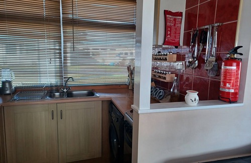 Llansaint Ski Chalet | Waves & Woods Cozy 2-bedroom chalet in enjoyable Kidwelly with WiFi