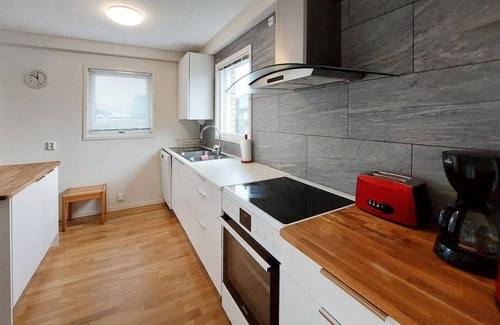 Lerberget House | Welcome to this spacious vacation home a short distance from the sea and sandy beach.
