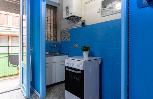Ferrara Apartment | White Cross Square A Touch of Blue Apartment