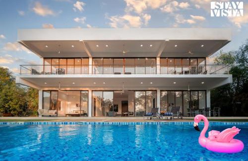 Zirad Villa | Wildflower Villa by StayVista - Poolside retreat with contemporary interiors & indoor activities