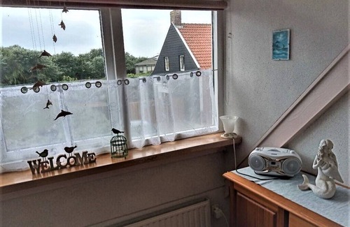 Westkapelle Apartment | Window view of the dunes! 10% weekly discount between September and December!