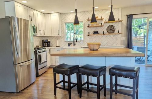 Wausau House | Wooded waterfront retreat with hot tub & fire pit