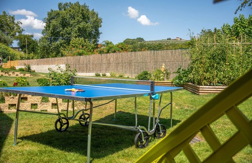 San Brizio Apartment | Wooden house with porch and garden