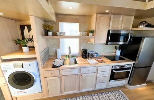 Pear Park House | XL tiny home with two lofted queen beds and full size futon on the main level.