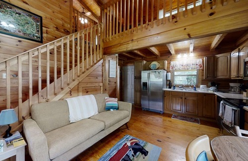 Newport Cabin | Yellow Cabin on the River: Pet Friendly, Free Attraction Tickets, Hot Tub & River Access