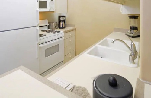 Canyon Corridor Condo | Yess! Full Kitchen & Heated Pool w/waterfall!