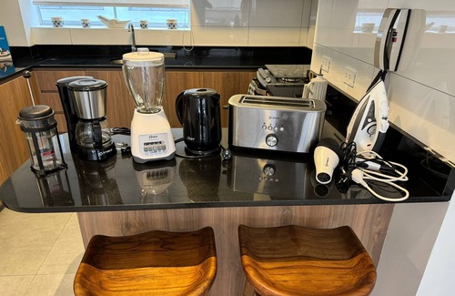 Santa Cruz Apartment | Your Malecon Haven: Air C , Heat & Nearby Eats.