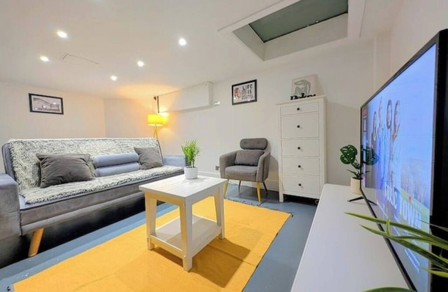 2BR unique basement living room with Netflix TV and sofa bed