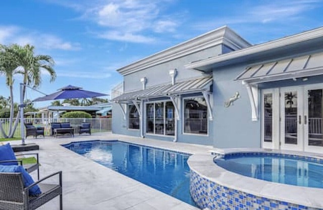 3BR Waterfront Villa with Heated Pool, Spa, & Rooftop Deck