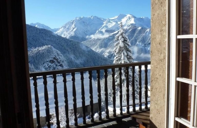 A balcony overlooking the Alps