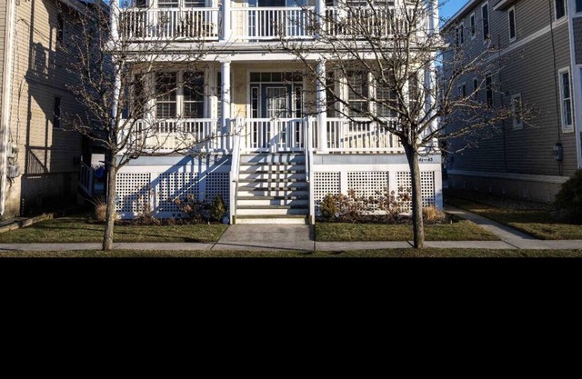 Adorable four bedroom 2 1/2 bath second floor condo with rooftop deck