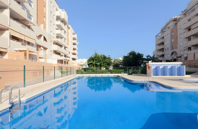 Apartment 'Jardines De Playa Gandia' with Shared Pool, Wi-Fi and Air Conditioning