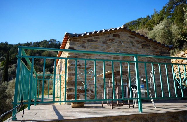 Artistic stone house next to the river